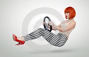 Young fashionable girl driver car with a wheel, auto concept