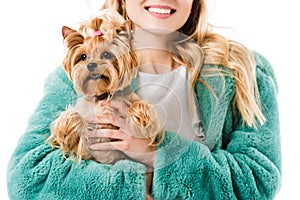 Young fashionable girl holding cute dog