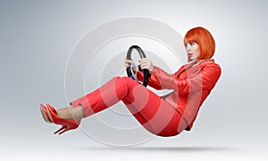 Young fashionable girl in red driver car with a wheel