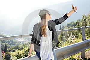 Young fashionable girl using smartphone.