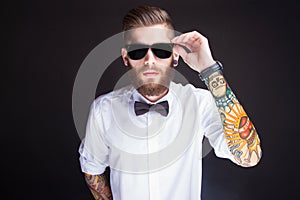 Young fashionable hipster man in white shirt