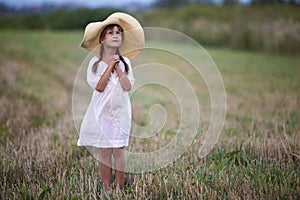 Young fashionable lovely cute girl with long braids in nice whit