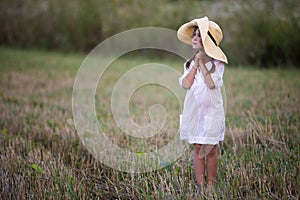 Young fashionable lovely cute girl with long braids in nice whit