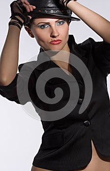 Young fashionable model with black hat