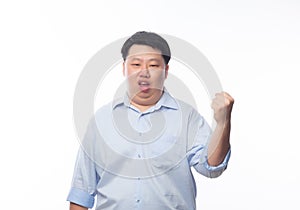 Young Fat Asian business man raising his fists with funny face isolated on white background.