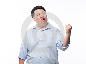 Young Fat Asian business man raising his fists with funny face isolated on white background.