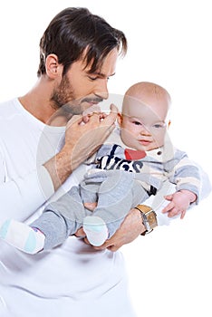 Young father cradling his baby on his arm photo