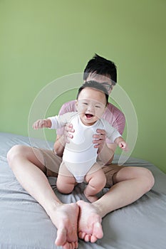 Young Father Happy Play with His Baby