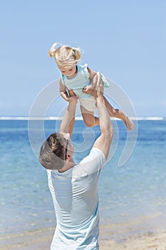 Young father having fun with his little daughter