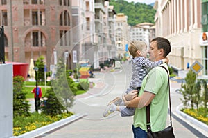 Young father with his son on a walk