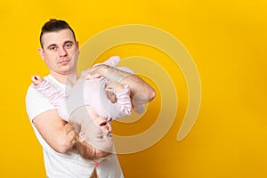 Young father hugging his baby daughter. Banner copy space