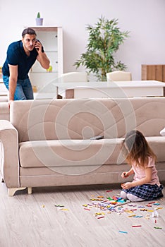 Young father and little girl indoors