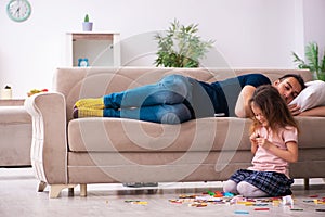 Young father and little girl indoors