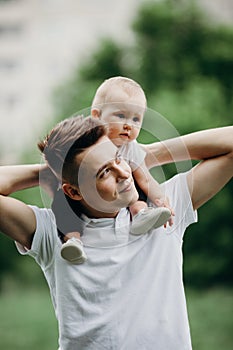 Young father piggyback adorable little daughter. Daddy and child