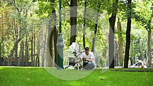 Young father playing with dog Jack Russell Terrier in park