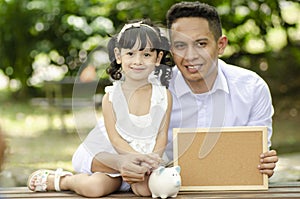 Young father spending time with his daughter at park during weekend
