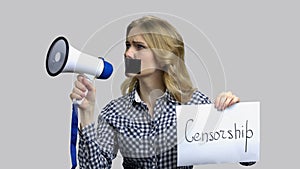 Young female activist protesting against censorship.
