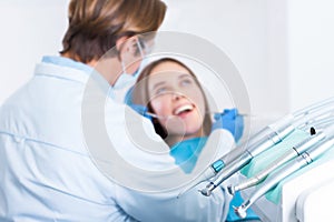 Young female adult woman patient at dentist office