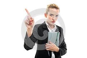 Young female assistant manager holding agenda showing denial gesture