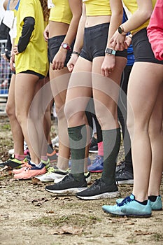 Young female atheletes ready to run. Start line. Athleticism