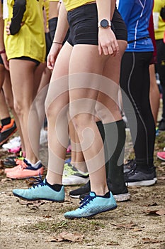 Young female atheletes ready to run. Start line. Athleticism