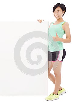 Young female athletes holding a empty board and thumb up.