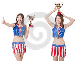 Young female boxer with cup isolated on white