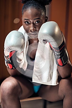 A young female boxer posing ready for a fight photo