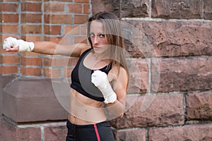 Young female boxer working out