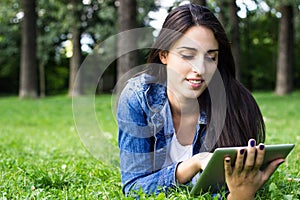 Young female browsing on digital tablet