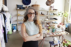 Young female business owner in a clothes shop, portrait