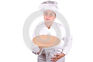 Young female chef showing a wooden dish