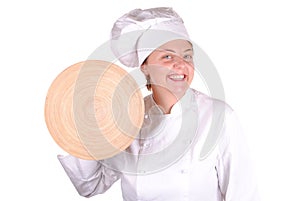 Young female chef showing a wooden dish