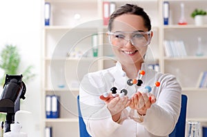 Young female chemist working in the lab