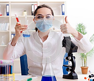 Young female chemist working in the lab