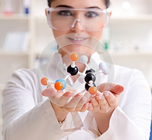 Young female chemist working in the lab