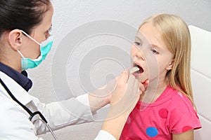 Young female child examined by woman doctor