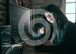 Young female computer programmer as hacker