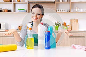 Young female contractor doing housework photo