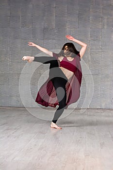 Young female dancer in movement.