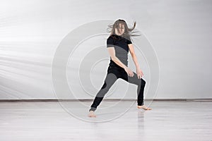 Young female dancer performing dance.