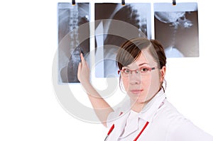 Young female doc pointing on x-ray, isolated