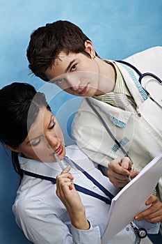 Young female doctor with assistant