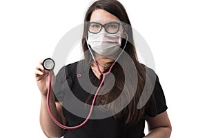 Young female doctor in black uniform wearing a mask, holding a stethoscope, isolated on white background