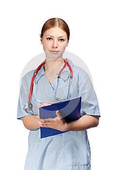 Young female doctor in blue surgical coat with red stethoscope a