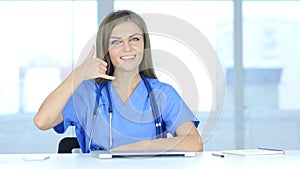 Young Female Doctor Call Us for Help Gesture