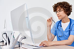 Young Female Doctor at Desk