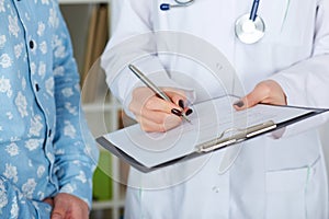 Young female doctor explaining diagnosis to her male patient.