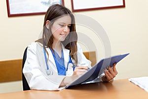 Young female doctor in her studio