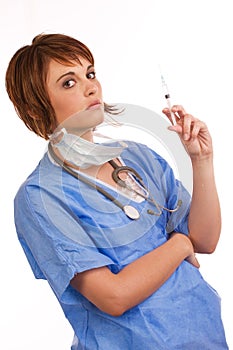 Young female doctor holding filled syringe